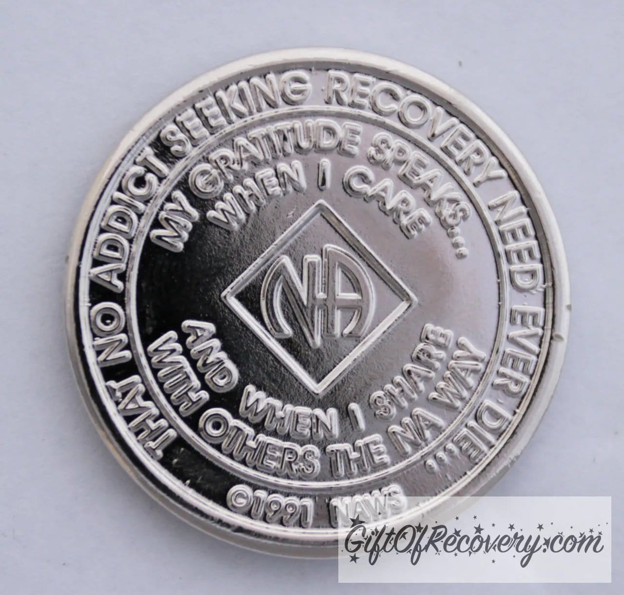 Back of NA nickel plated crystalized light rose medallion has the NAWS official slogans and motto.