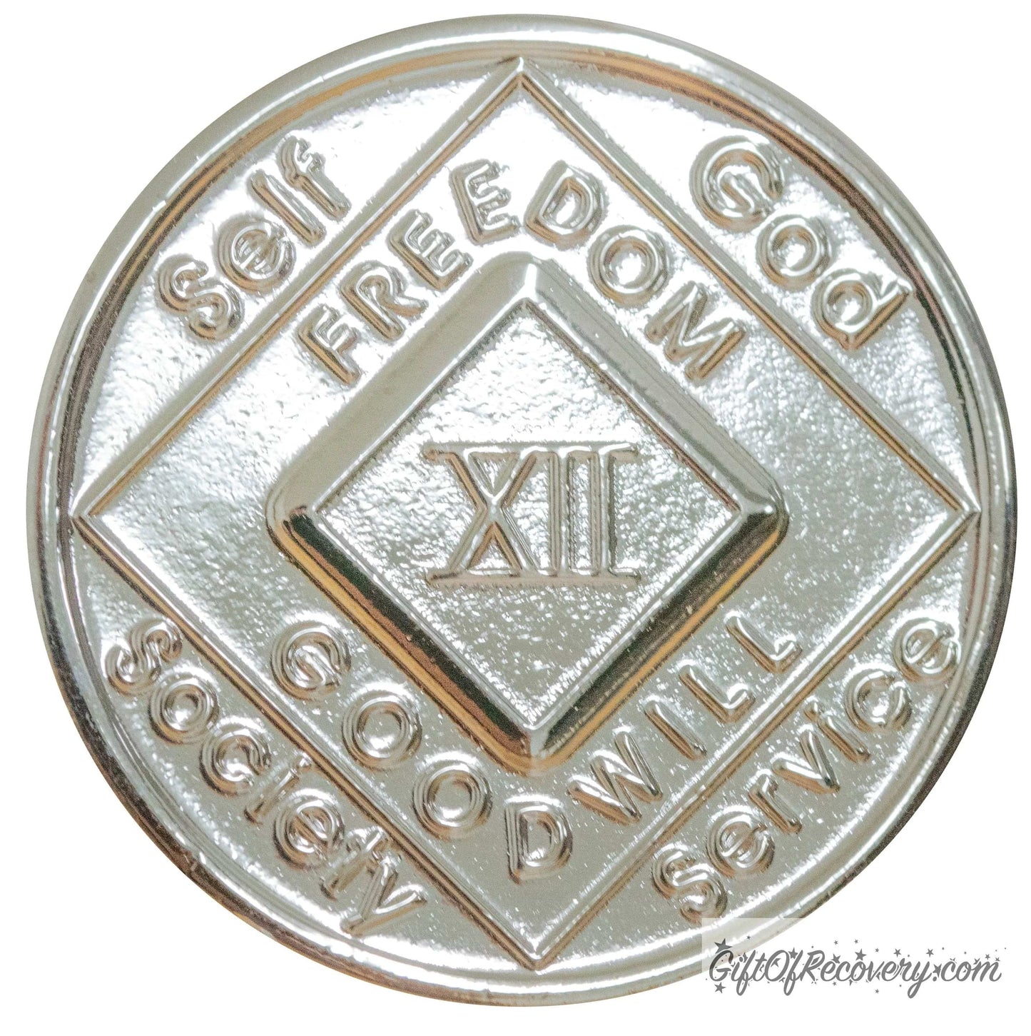12 year nickel plated NA medallion with self, God, Society, and Service around the outer rim of the diamond, Freedom and goodwill on the inside of the diamond.