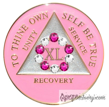 40 year princess pink AA medallion with a pearl white triangle center and pink circle, surrounding the roman numeral 40 are 10 genuine crystals, 5 dark pink and 5 clear, perfect for your favorite sober princess, to thine own self be true, unity, service, recovery, the rim of the medallion, the raised triangle outline, and the roman numeral year, are in 14k gold, sealed with resin for a glossy finish.