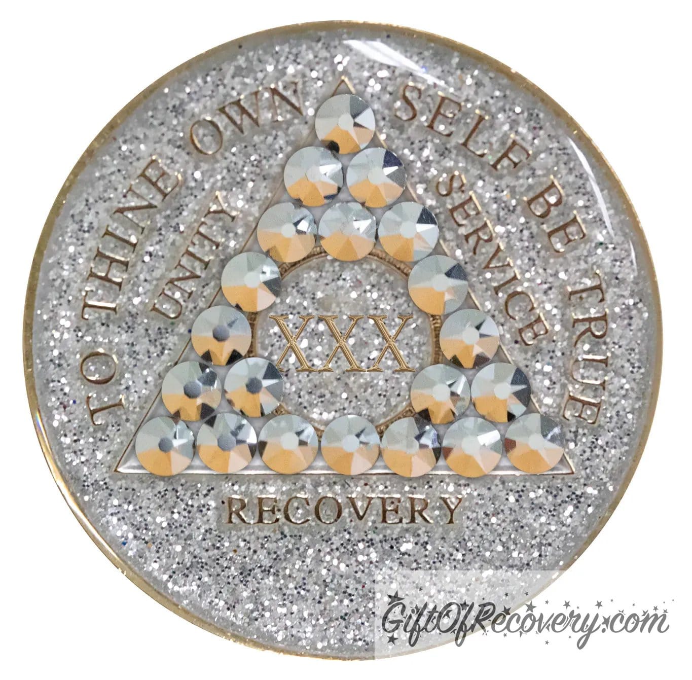 30 year silver glitter AA medallion with 21 genuine comet crystals, forming a triangle around the 1 year, while the year, unity, service, recovery, rim, and To Thine Own Self Be True are embossed in 14k gold, sealed with resin to give it a glossy finish, hand painted and scratch resistant.