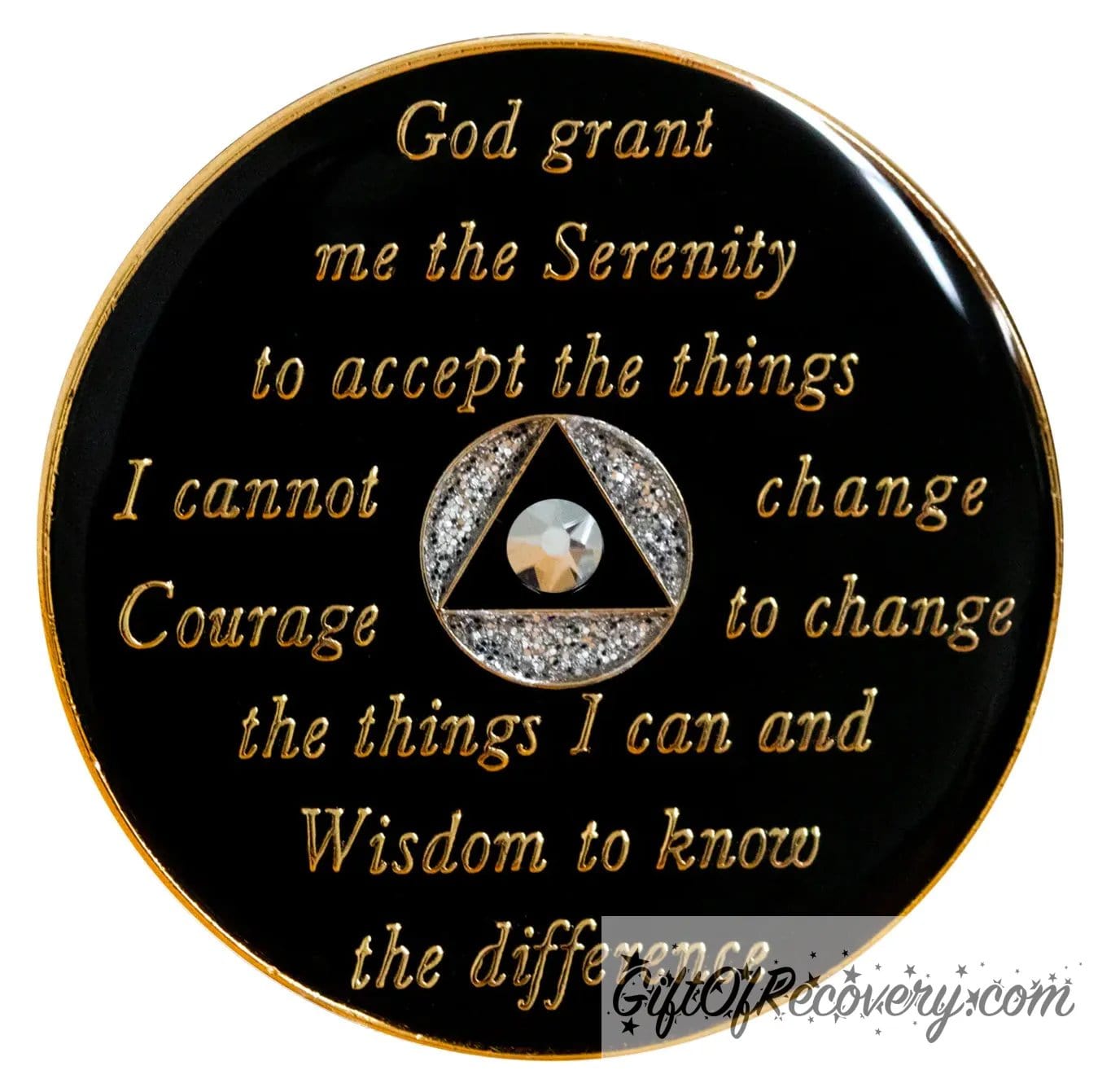 Back of silver glitter AA Medallion comet crystal recovery medallion is black and has the raised serenity prayer, outer rim, and the circle triangle in the center in 14k gold, inside the black triangle is 1 comet genuine crystal, with silver glitter accents in the circle.