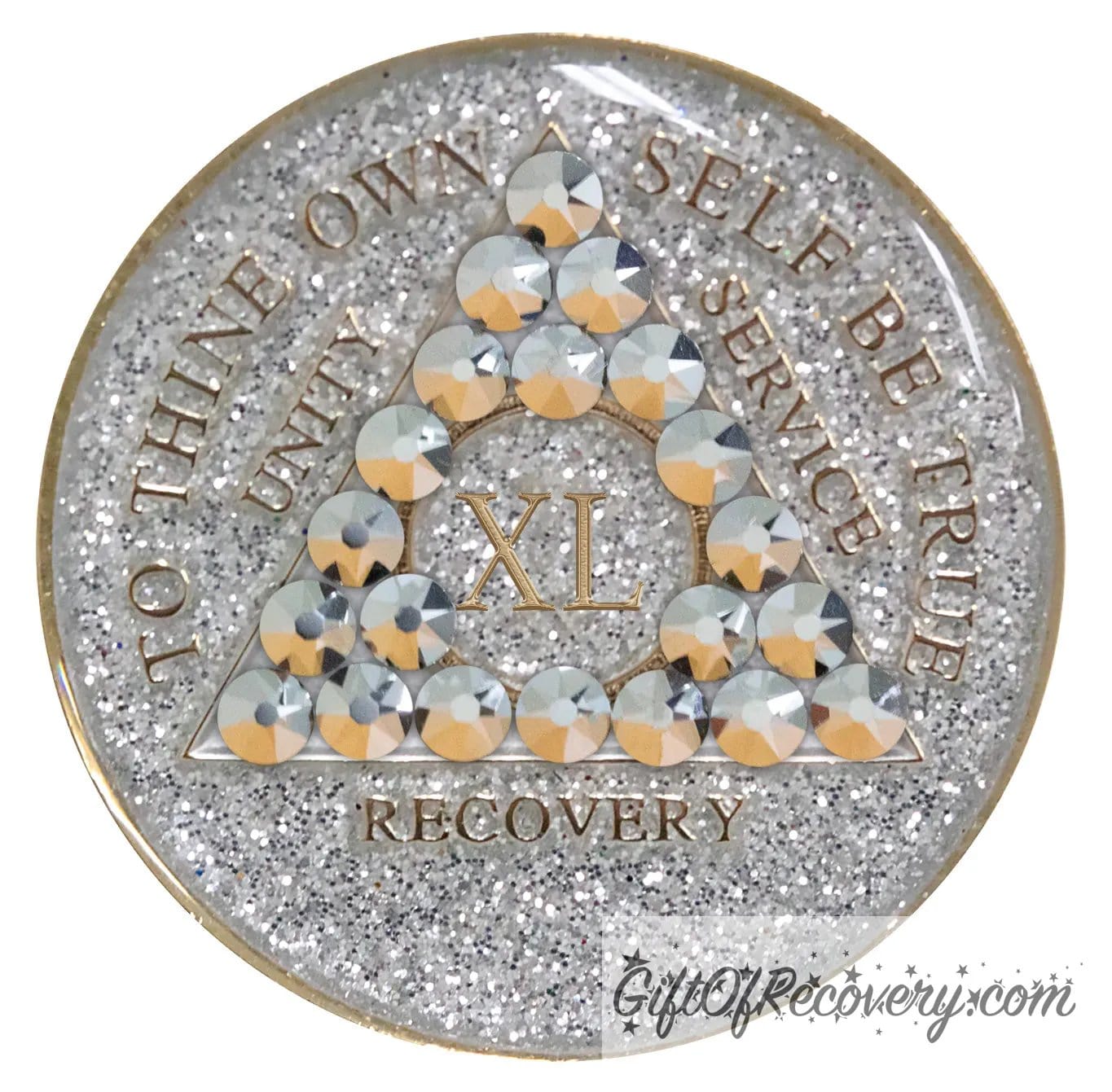 40 year silver glitter AA medallion with 21 genuine comet crystals, forming a triangle around the 1 year, while the year, unity, service, recovery, rim, and To Thine Own Self Be True are embossed in 14k gold, sealed with resin to give it a glossy finish, hand painted and scratch resistant.