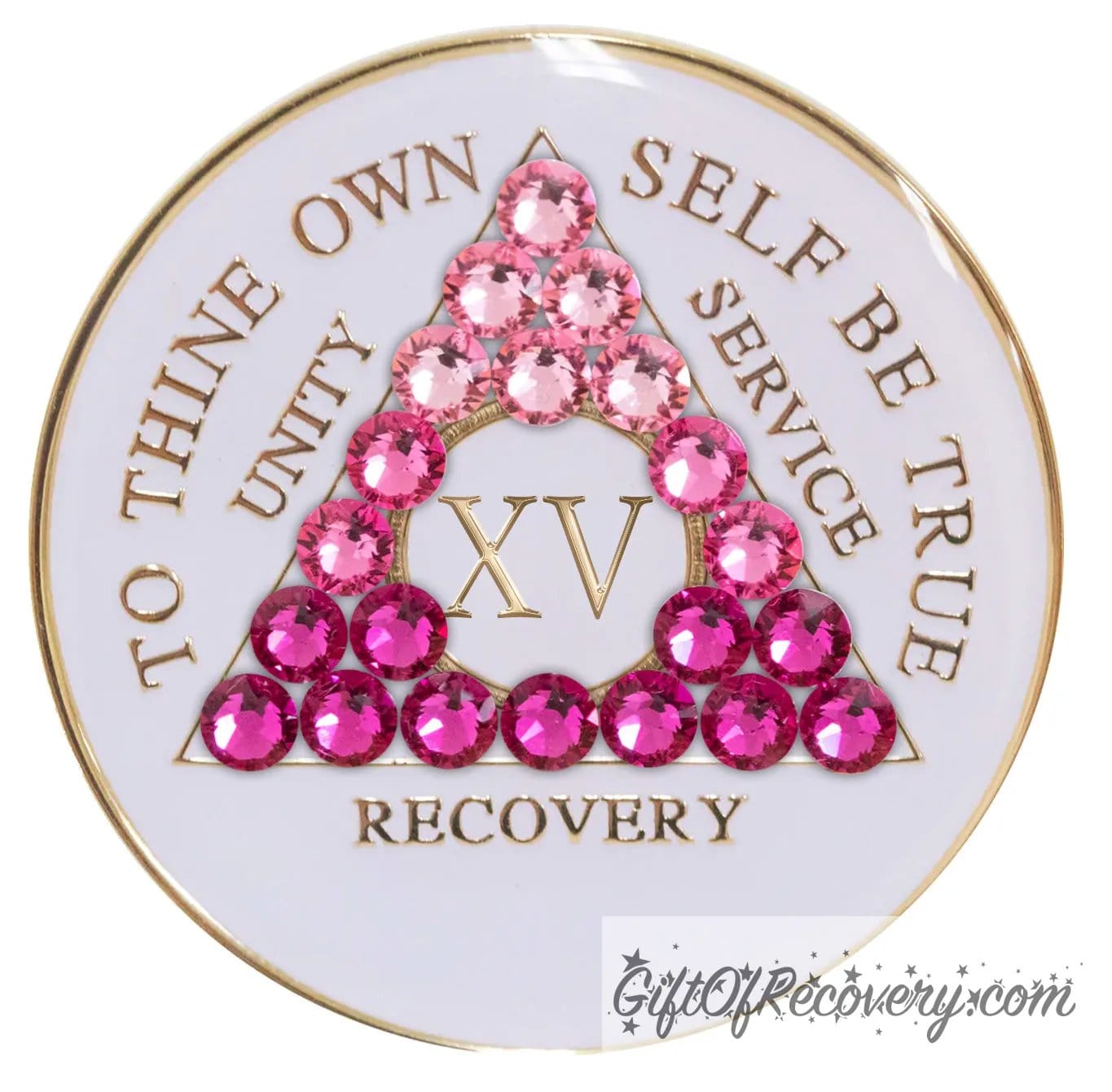 15 year pearl white AA medallion with 21 genuine crystals in the shape of the triangle and ranging from light to dark pink, representing the transformation of your sobriety journey, the AA moto along with the roman numeral and rim of medallion are 14k gold plated brass and sealed with resin for a glossy finish.