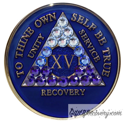 15 year Big Book Blue AA medallion with 21 genuine crystals forming the triangle, going from light to dark blue to represent transitions in your recovery journey, the center circle is blue sparkle, with the roman numeral, AA moto and rim in 14k gold plated brass and resin sealed for a glossy finish.