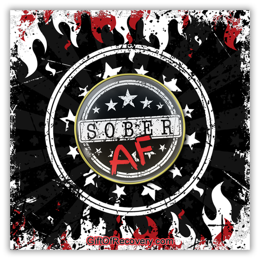 Sober AF AA medallion with sober in black on a white rectangle strip, and the AF in bold red, there are 10 white stars, 5 above sober and 5 below, there are 2 white circles near the 14k rim for outline. The medallion is placed on a black 3x3 card with white and red flames on the top and bottom, with a stamped depiction of the sober AF recovery medallion.