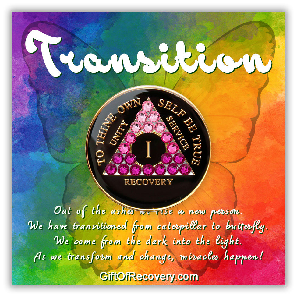 1 year black onyx AA medallion with 21  pink genuine crystals in the shape of the triangle representing transformation journey of recovery, the moto of AA is displayed on the front and embossed with 14k gold-plated brass, the recovery medallion is sealed in resin to last and is scratch proof, the medallion is featured on a 3x3 bold colored tie-dye card with a butterfly silhouette and a paragraph outlining a transitional view regarding recovery.