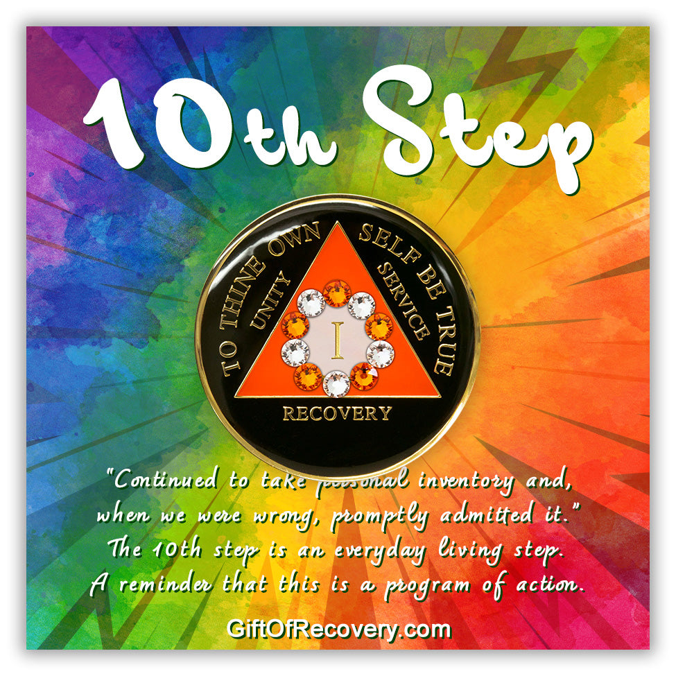 1 year onyx black and sunset orange 10th step AA medallion, with 10 genuine crystals, emphasizing action and reflection, placed on a bold tie dyed card with a small paragraph of the meaning of the 10th step, and triangle and lettering embossed in 14k gold.