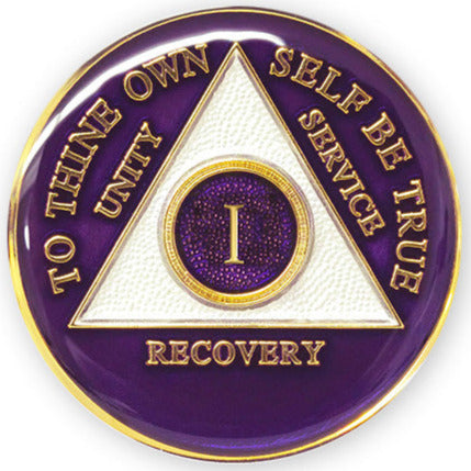 1 year AA medallion Amethyst purple, recovery is possible, triangle is pearl white, to thine own self be true, unity, service, recovery, and roman numeral are embossed with 14k gold-plated brass, the recovery medallion is sealed with resin for a glossy finish that will last and is scratch free, pictured on a white 3x3 card with recovery is a gift going through an open heart at the top and giftofrecovery.com on the bottom, both in the color gold.