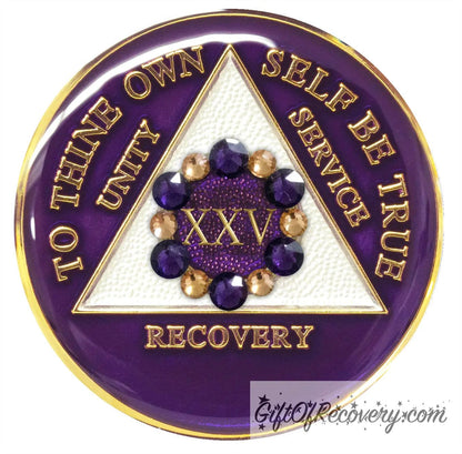 25 year AA medallion purple Amethyst adorned with 6 gold and 6 purple genuine crystal in a circle around the roman numeral to symbolize a flower and to bloom where planted in your recovery journey, triangle is pearl white and AA moto is embossed with 14k gold-plated brass, sealed in resin for a glossy finish that will last and is scratch proof.