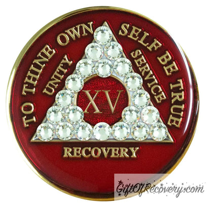 15 year ruby red AA medallion adorned with 21 genuine diamond CZ crystals emphasizing the growth under pressure like true diamonds are formed, to thine own self be true, unity, service, recovery are embossed with 14k gold-plated brass and sealed with resin for a glossy finish that is scratch proof and will last.