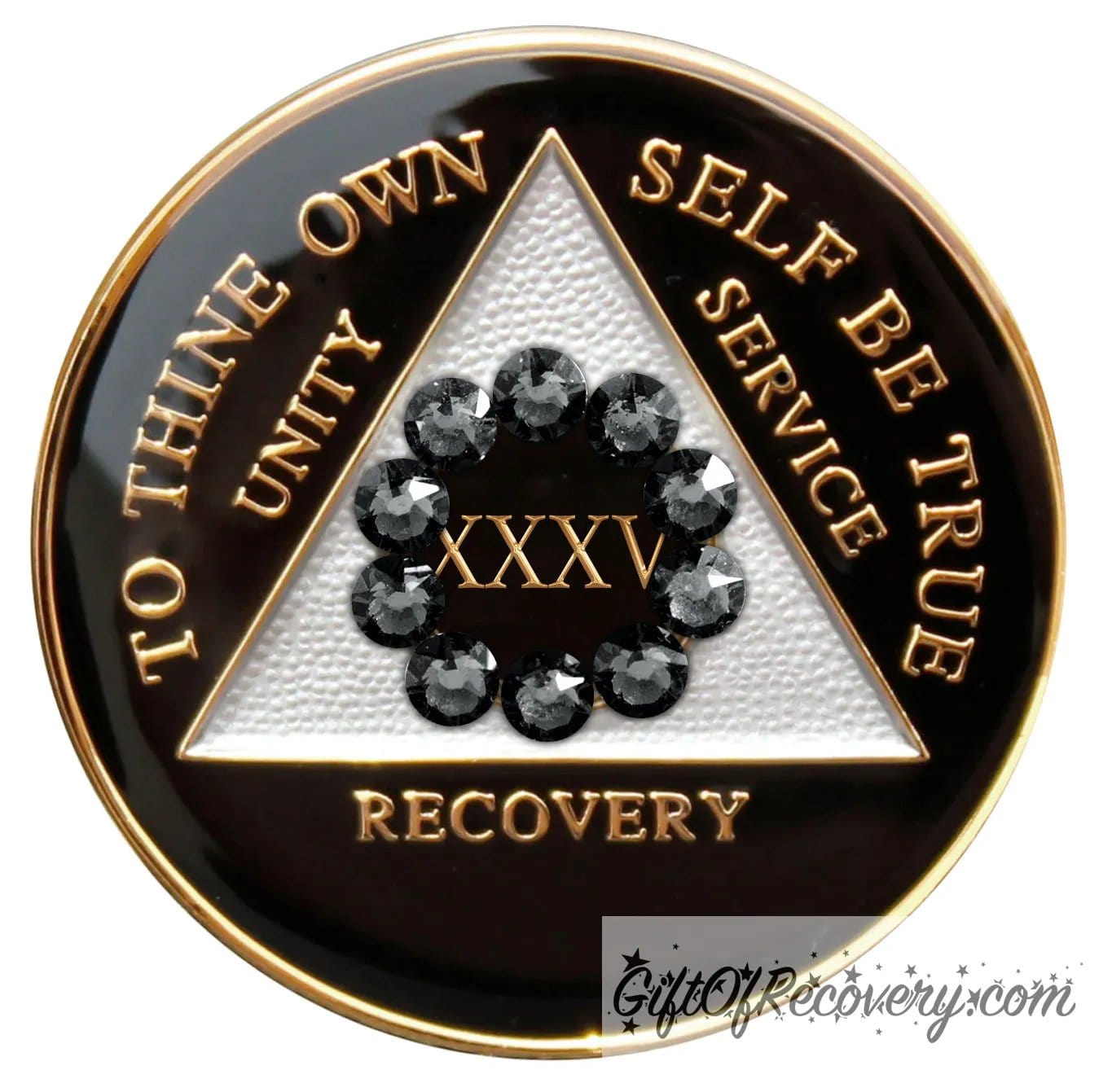 35 Year AA medallion black onyx with white triangle and 10 genuine black crystals around the number to symbolize our unity in the program, AA moto and 3 legacies are embossed with 14k gold-plated brass and it is sealed with resin for a glossy finish.