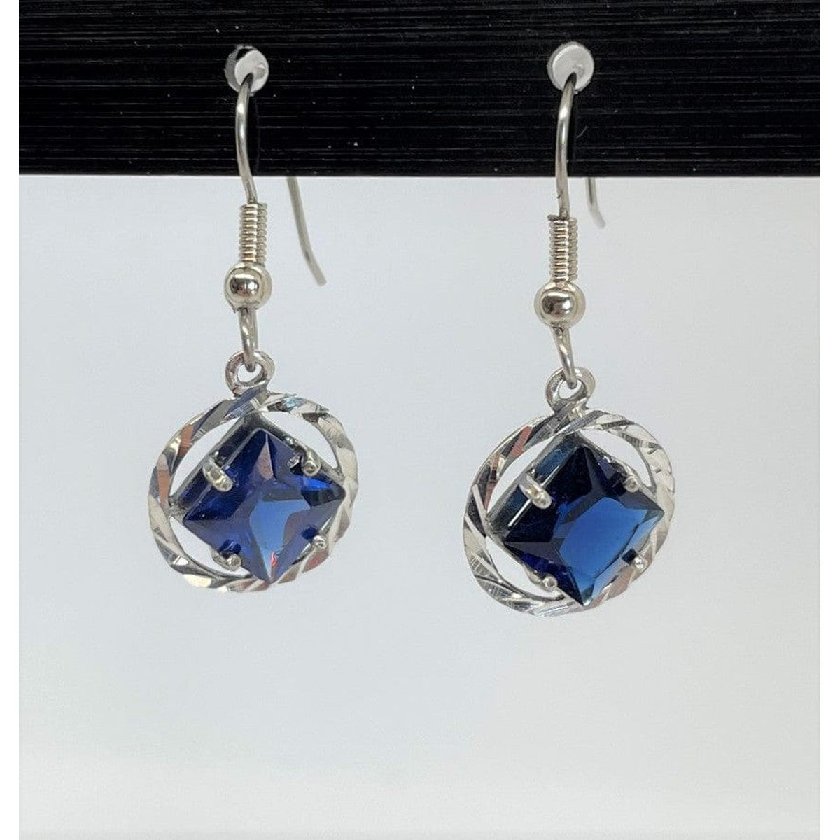 Sterling Silver, NA Symbol Earrings With 4 Different 8Mm Square Colored Cz Stones Dark Blue